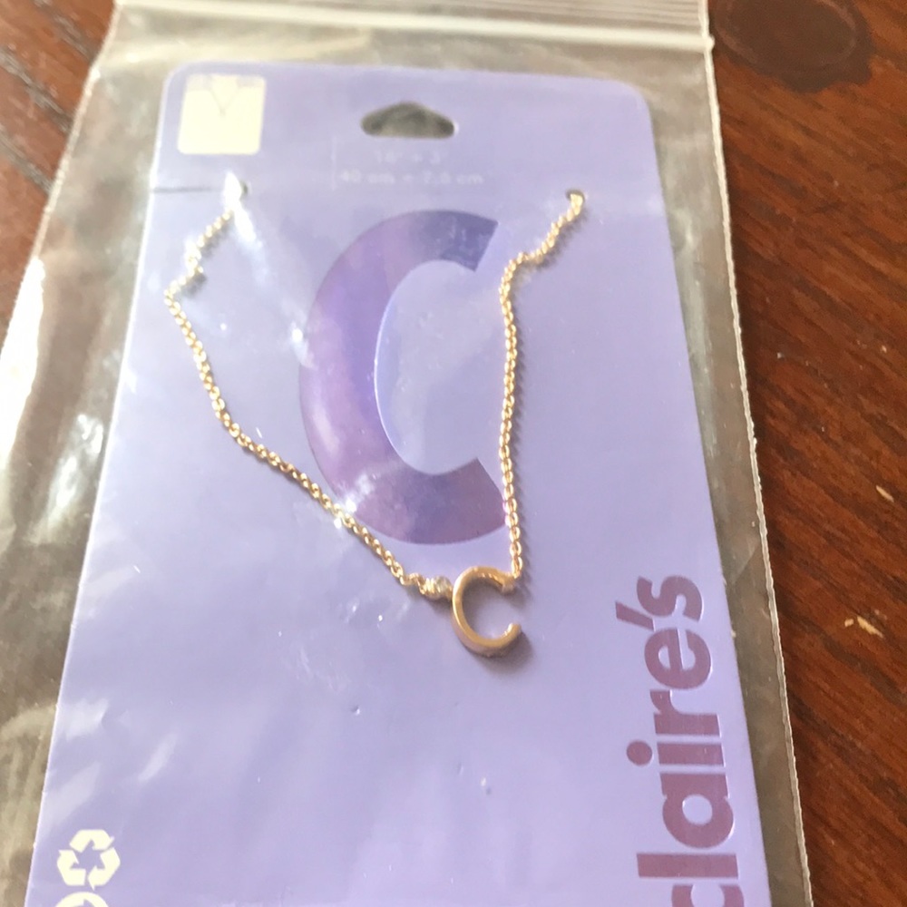Gold tone necklace letter C